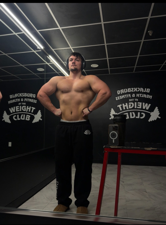 Caleb Grider, also known as Tarzan Lifts, practices bodybuilding poses after finishing a lift – Shot with iPhone 15